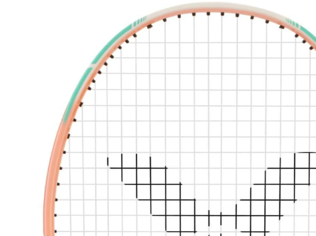 Close-up of a badminton racket with a grid background