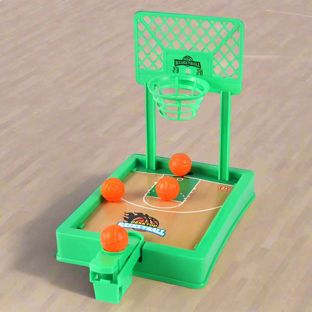 Green toy basketball hoop with basketballs on a white and green background