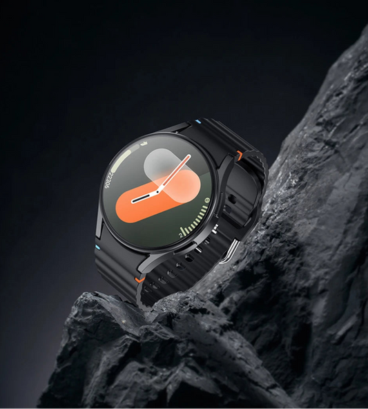 Smartwatch on a rocky surface with a dark background