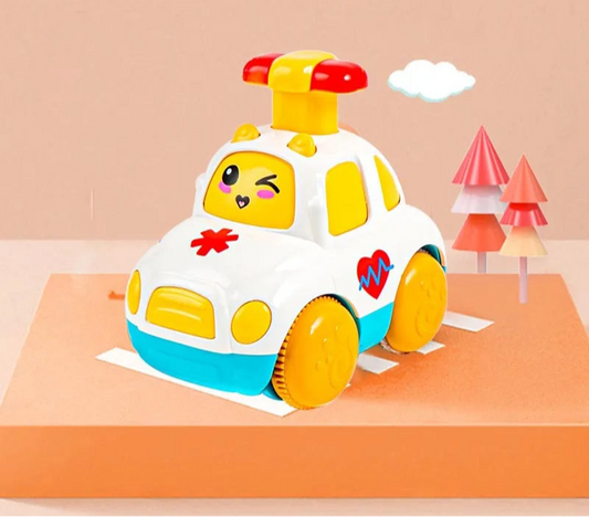 white ambulance wind up toy with a wink face windscreen
