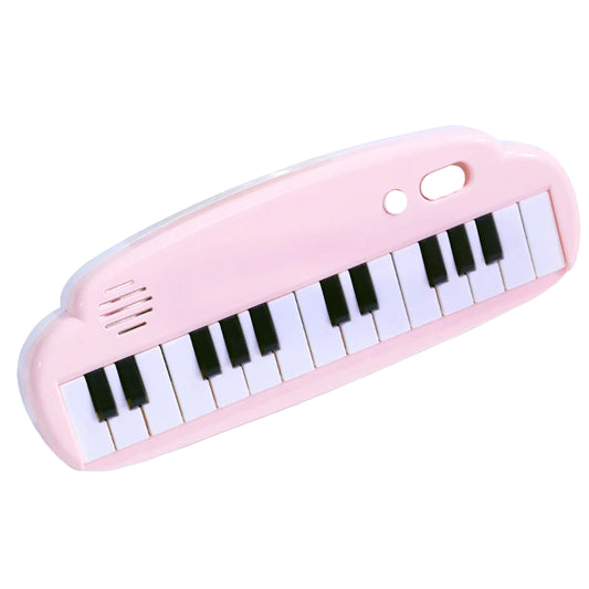 Pink toy keyboard with black keys on a white background